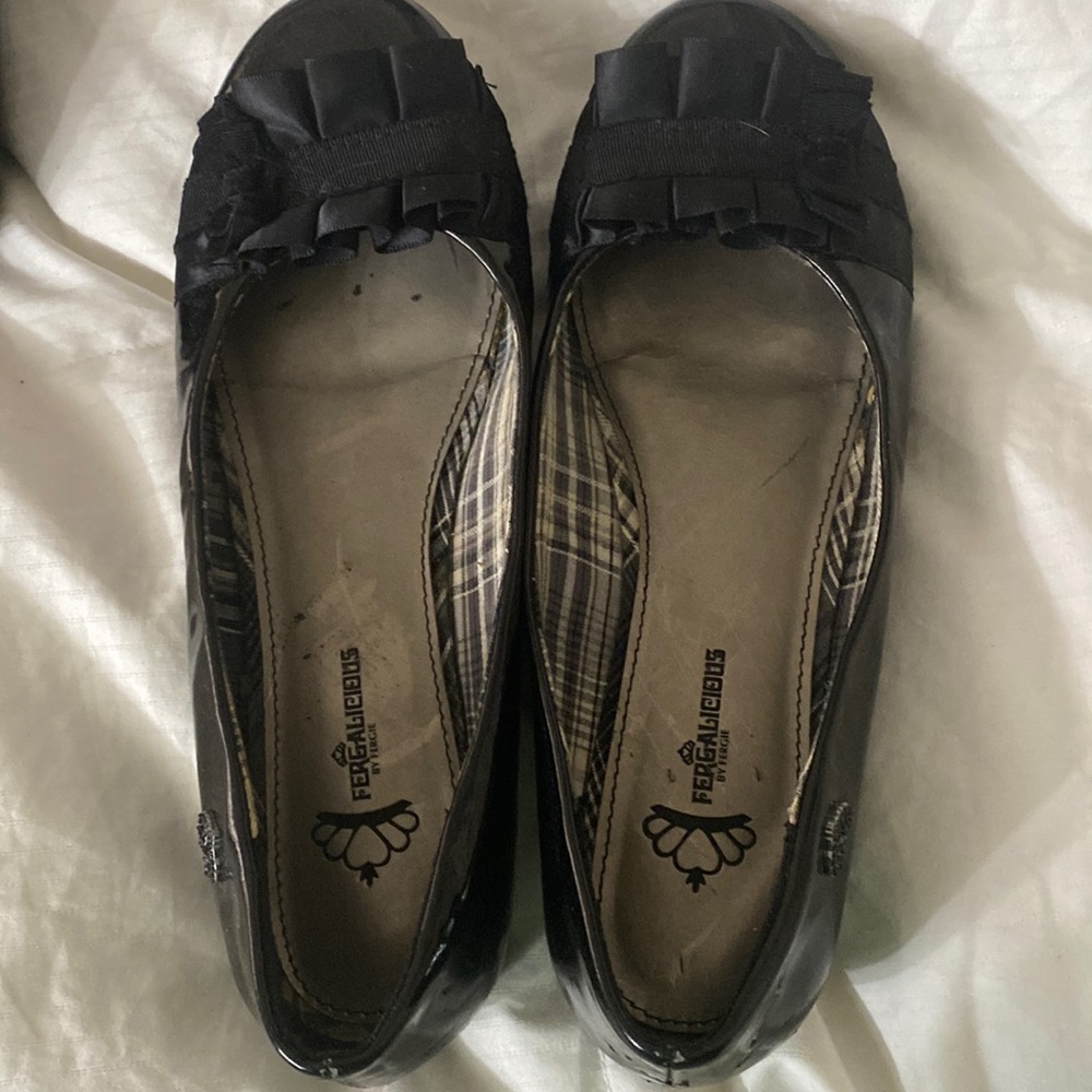 Fergalicious size 8 1/2 medium slip Ons black shoes with bows